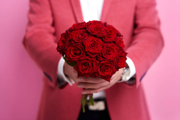 istock Unrecognizable man giving bunch of rose 877308050