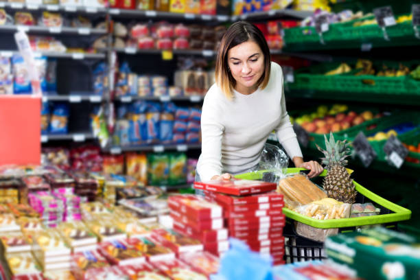 istock Woman choosing delicious sweets 877308690