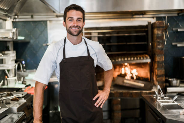 istock Portrait of confident chef in commercial kitchen 877309558