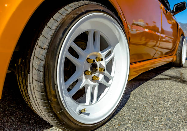 istock Flat white rims on an orange car 877312384