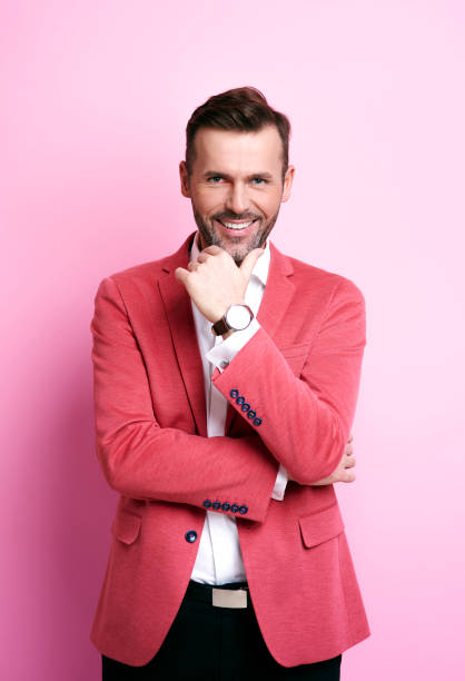 Smiling man holding his chin