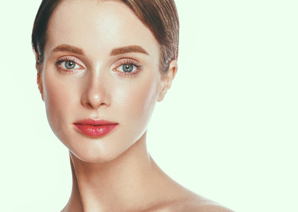 istock Beautiful woman face close up studio on white. 877313138