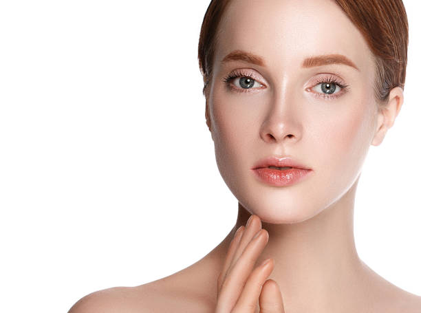 istock Beautiful woman face close up studio on white. 877313252
