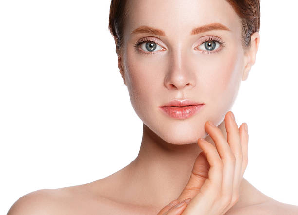 istock Beautiful woman face close up studio on white. 877313550