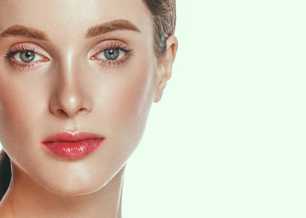istock Beautiful woman face close up studio on white. 877313682