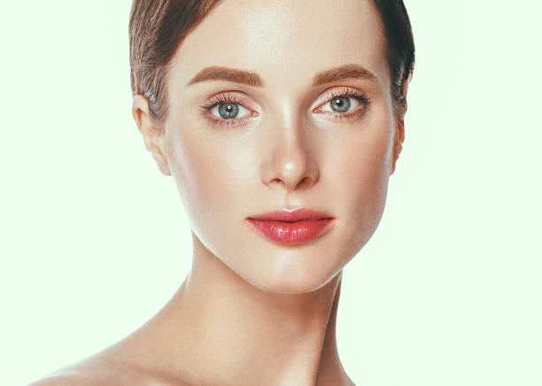 istock Beautiful woman face close up studio on white. 877313686
