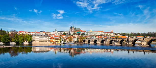 Charles bridge over Vltava river and Gradchany Prague Castle a Panorama of Charles bridge over Vltava river and Gradchany (Prague Castle) and St. Vitus Cathedral. Czech Republic hradcany castle stock pictures, royalty-free photos & images