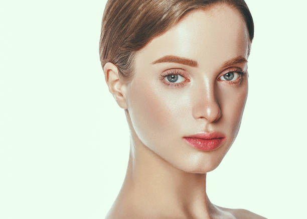 istock Beautiful woman face close up studio on white. 877316386