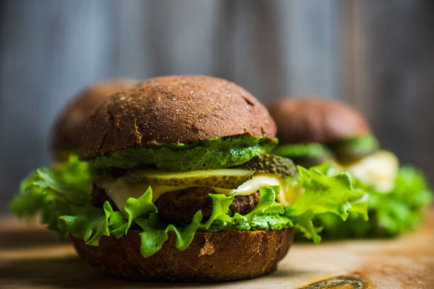istock Burgers on the dark rustic background 877317492