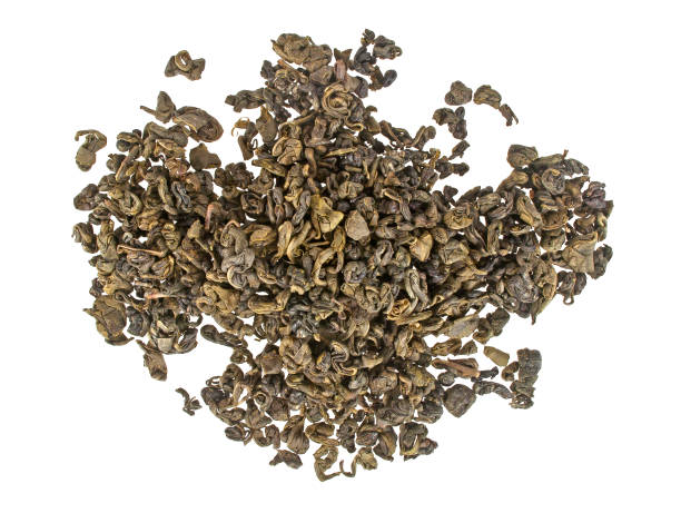 istock Heap of dry green tea isolated on white background 877321184