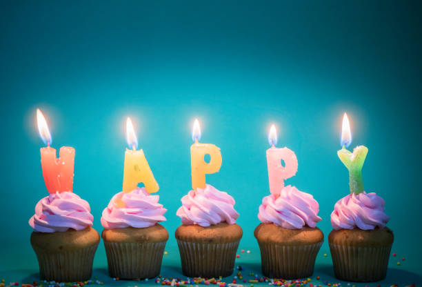 istock pink cup cake with candle 
