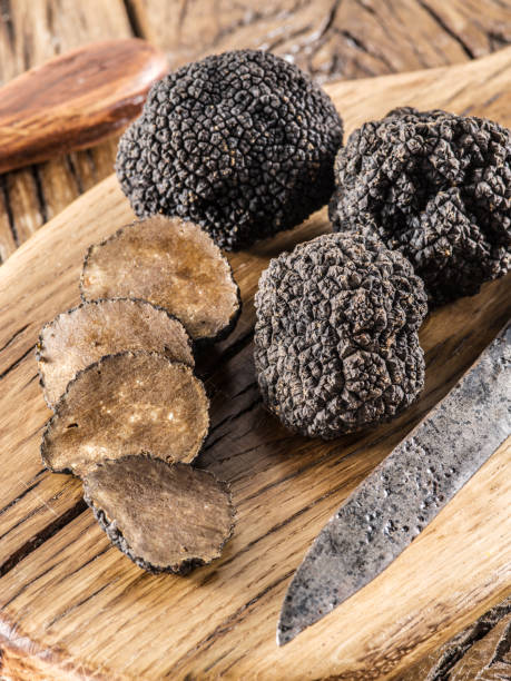 istock Cutting of black truffle. 877321706