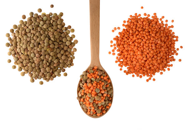 istock Red and green Lentils isolated on white background. 877324524