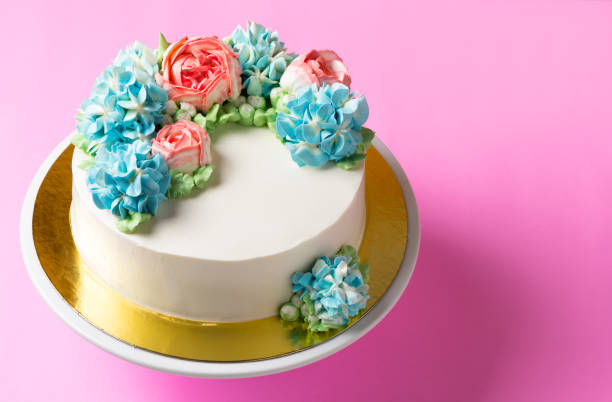 istock cute flower cake on cake stand 877324898