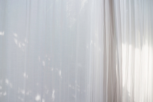 Net curtain background with sun light, stock photo