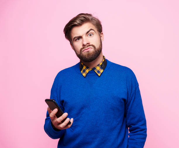 istock Amazed man with mobile phone 877330070