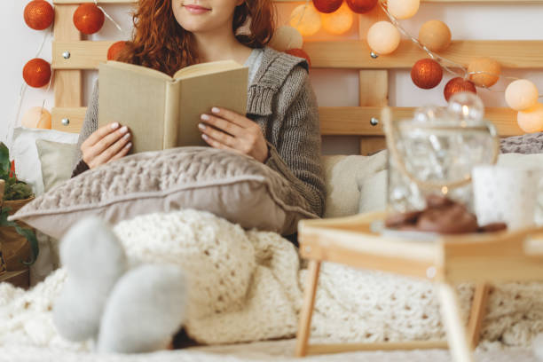 girl reading a book - material data sheets imagens e fotografias de stock