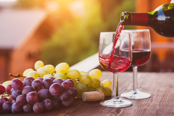 istock red wine pouring to the glass 877333880