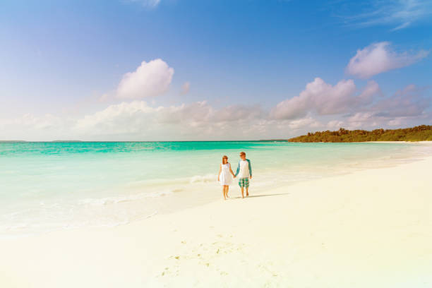 istock happy loving couple enjoy tropical beach 877337246