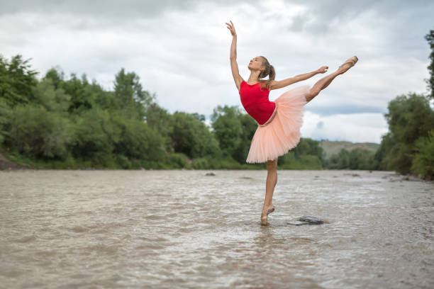 istock Ballerina posing in river 877337864