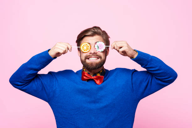 istock Funny man with lollipops on eyes 877338042