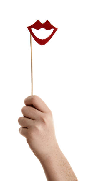 istock Photo booth prop of smiling red lips held aloft 877344930