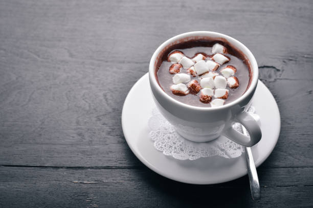 istock Cappuccino with marshmallow. On a wooden background. Top view. Free space for your text. 877347704