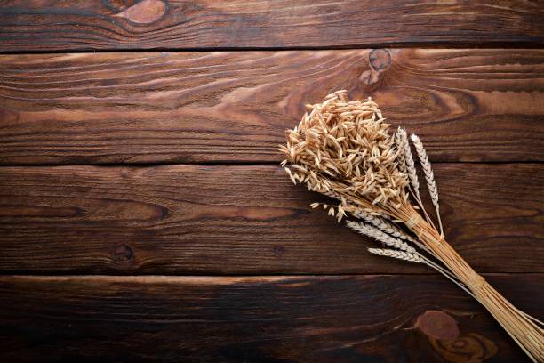 istock Wheat, oats, corn. On a wooden surface. Top view. Free space for your text. 877347840