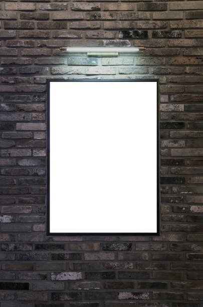 Exhibition or advertising poster frame design template. Brick wall with picture frame and lights.