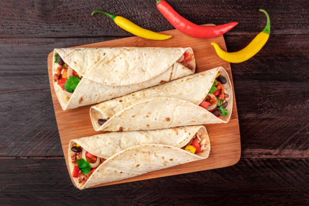 istock Mexican burritos with chili peppers, and copyspace 877349104