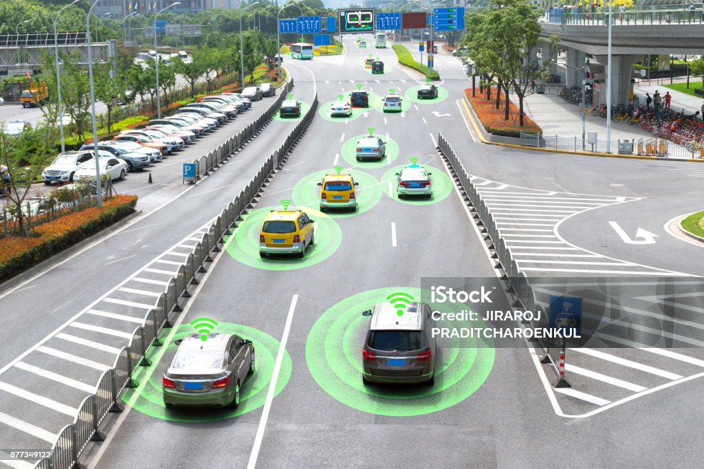 Smart car (HUD) and Autonomous self-driving mode vehicle on metro city road with graphic sensor signal. Driverless Car Stock Photo