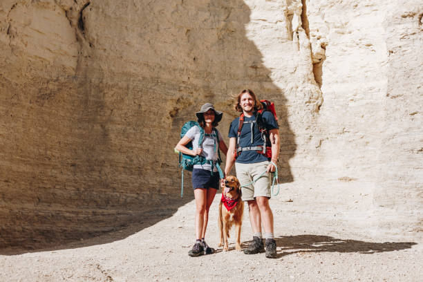 istock Couple hiking together in the wilderness 877350184