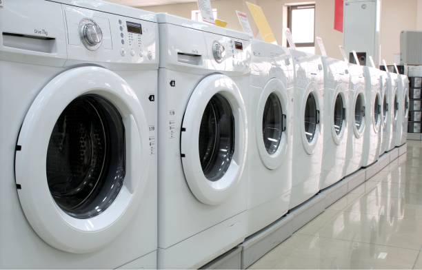 istock Rows of washing machines in a store 877354528