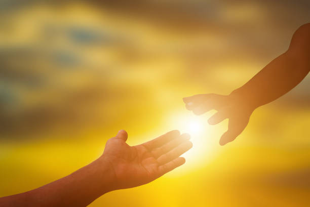 istock Silhouette of helping hand. 877354732