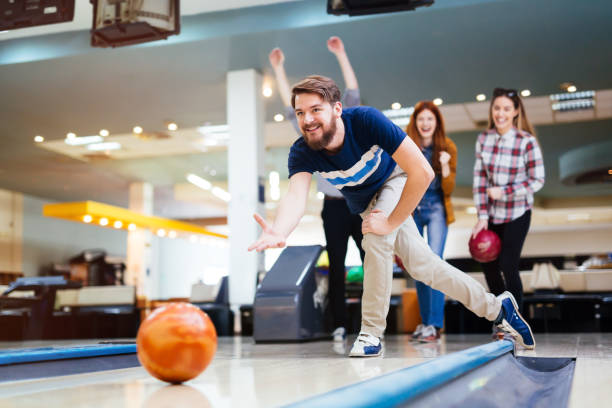 istock Friends bowling at club 877357156