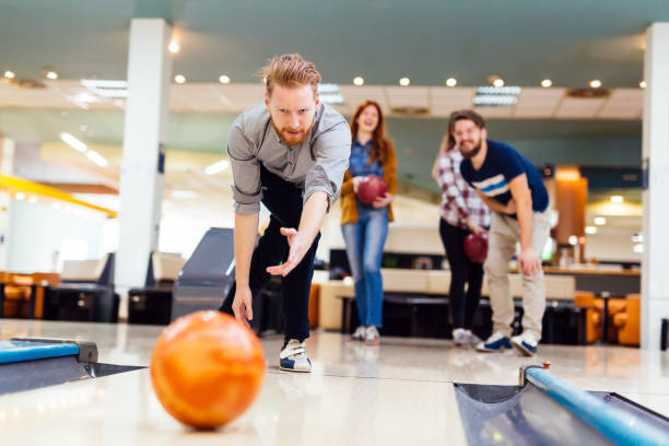 istock Friends bowling at club 877361026