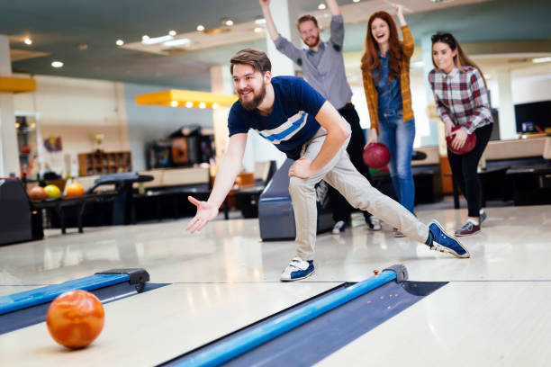istock Friends bowling at club 877363296