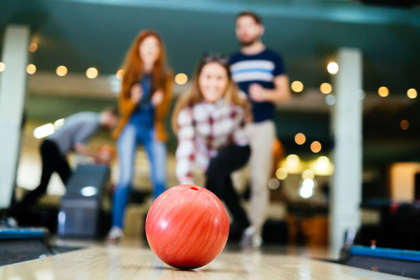 istock Friends bowling at club 877363664