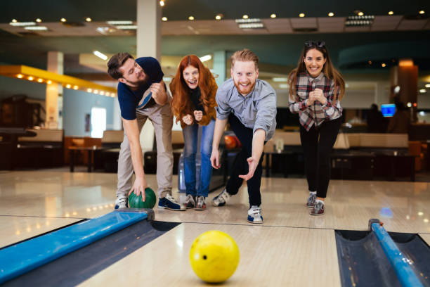 istock Friends enjoying bowling at club 877363718