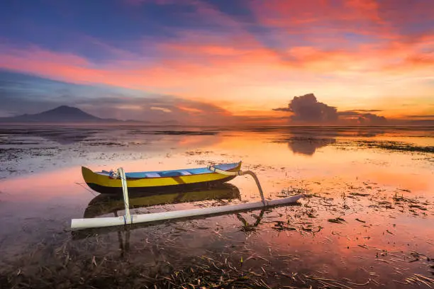 Boat at beautiful sunrise on Bali island, Indonesia