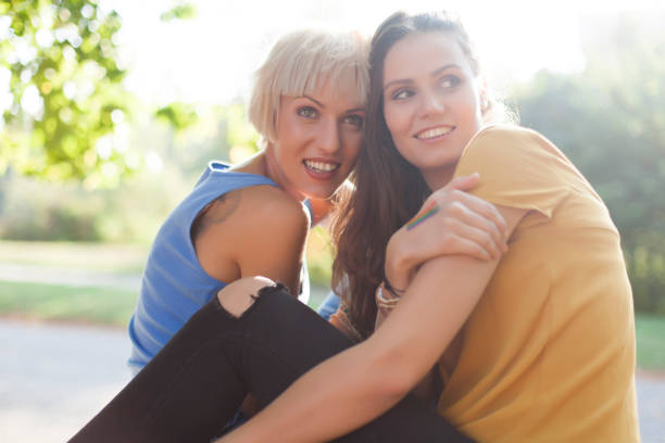 istock Girls resting in park 877372360