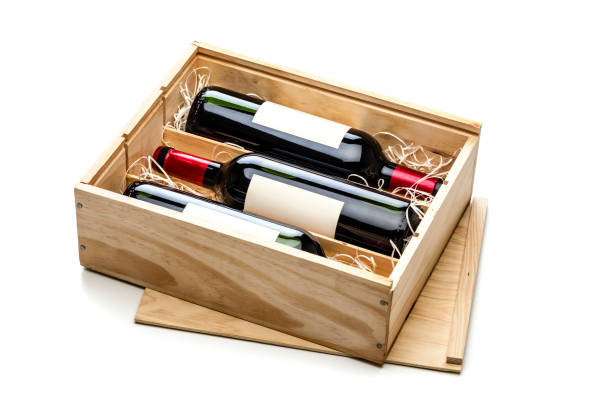 opened wooden box with three red wine bottles inside it isolated on white background - wine wine bottle box crate imagens e fotografias de stock