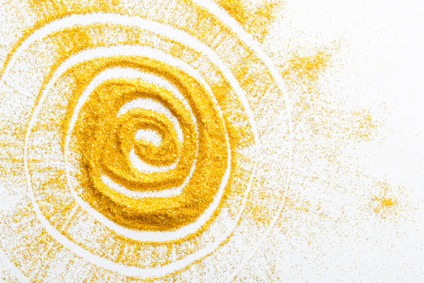 Abstract backgrounds of spiral design by hand on the white sand beach.