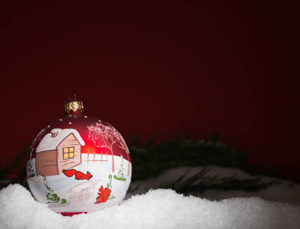 istock christmas ball lying in the snow 877381290