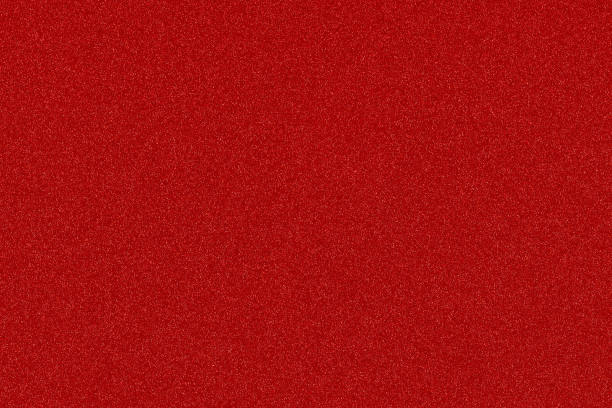 istock red Christmas background with shiny color speckles 877387514