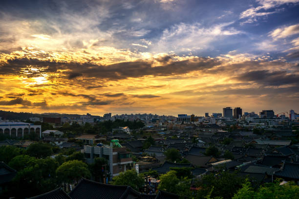 Jeonju Hanok village during sunset hours. Traditional Korean Folk village illuminating under the sunset.