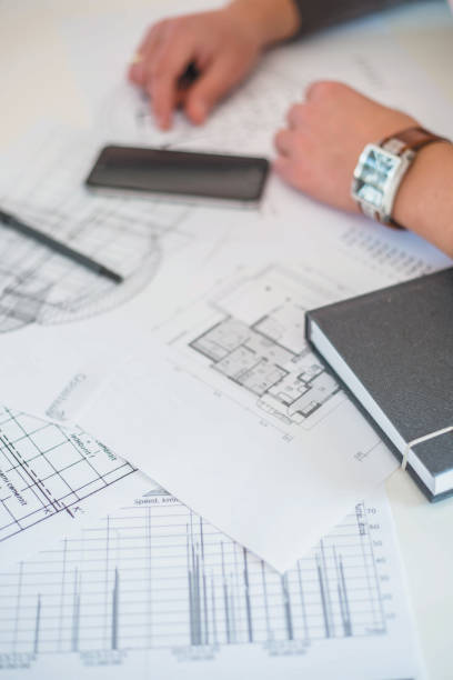 istock Businessman making plans and designing 877390434