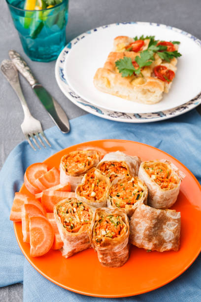 istock Rolls with vegetables and casserole on gray background. 877393532