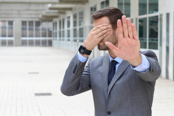 istock Business covering his eyes to avoid reality 877394674