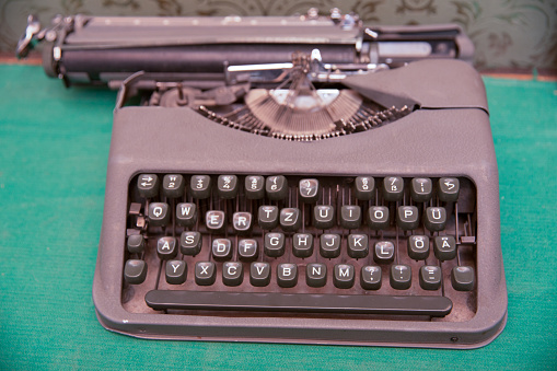 Antique Typewriter. Vintage Typewriter Machine Closeup Photo. keyboard layout in English
